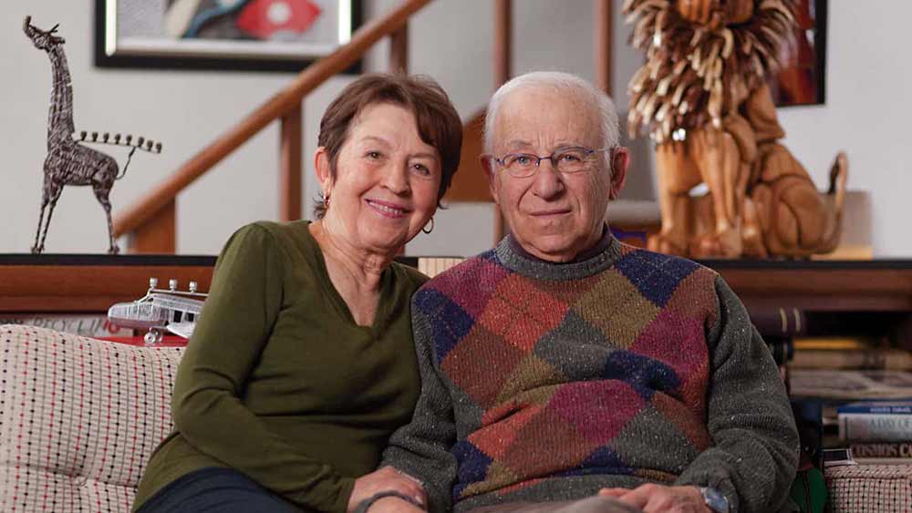 senior couple sitting on sofa