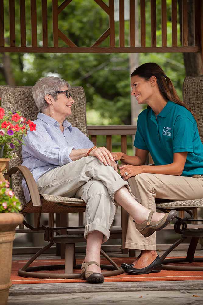 senior-and-right-at-home-caregiver-sitting-outdoors