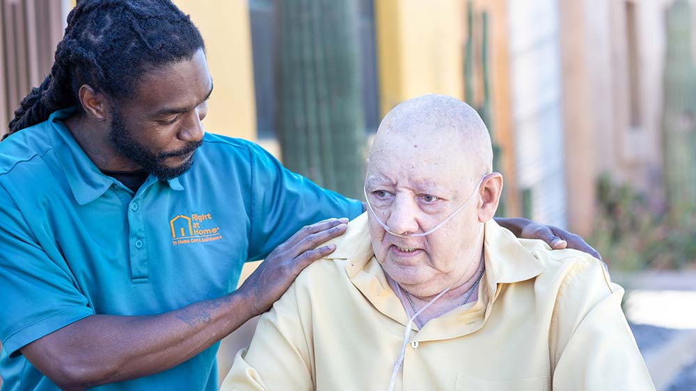 mail-caregiver-comforting-senior-man-using-oxygen