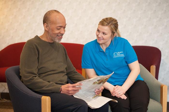 caregiver waiting with senior client to see doctor