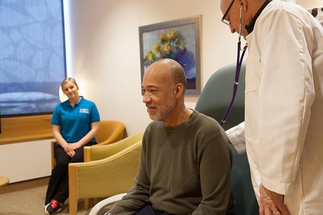 caregiver assisting senior client at doctor appointment