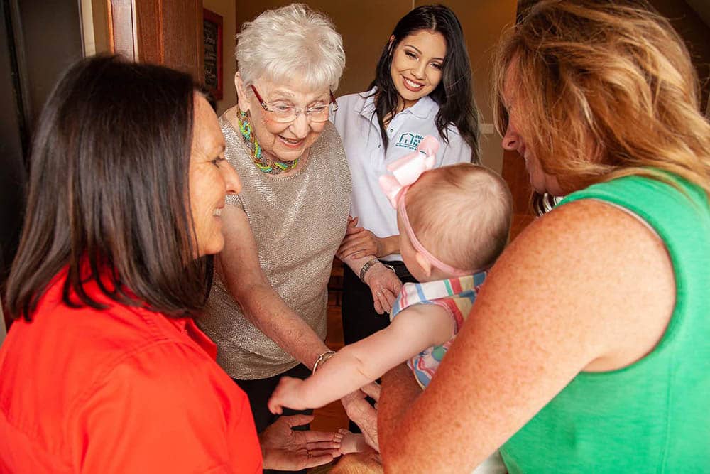 family visiting senior