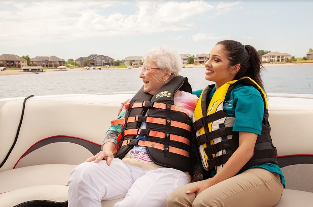 Caregiver and senior client on boat ride