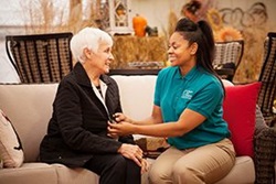 Caregiver helping groom senior