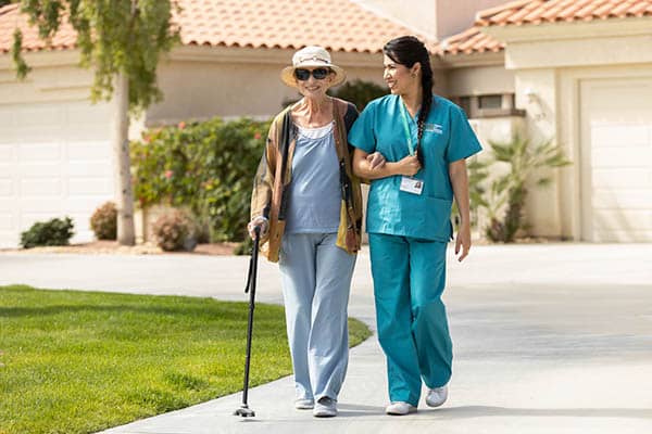 client and caregiver walking outside