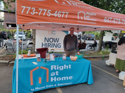 Right at Home Booth with Now Hiring sign at Ravenswood Farmers Market