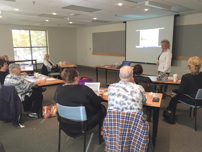 Seniors listening to a speaker at the Caring for the Caregiver Seminar in St Charles, IL.