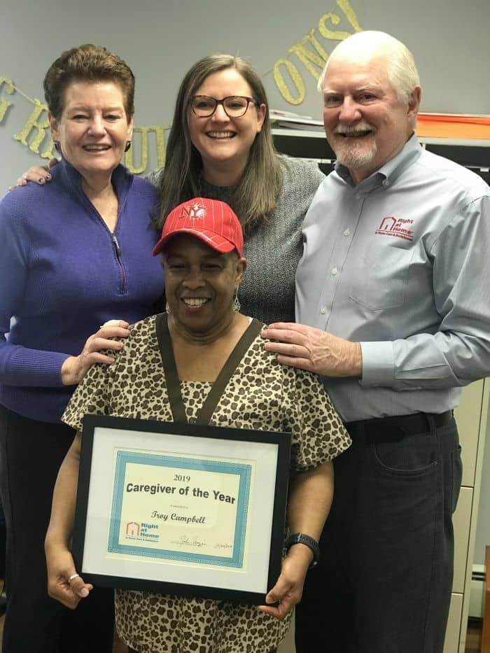 2019 Caregiver of the Year Troy Campbell with office staff