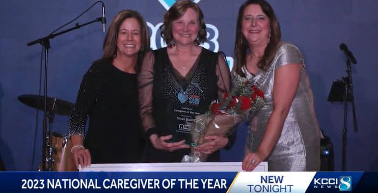 Caregiver Vicki Bailiff accepting her caregiver of the year award
