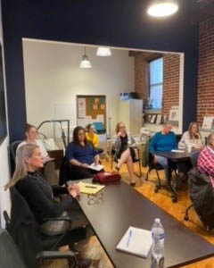 Employees listening to the speaker at the training event