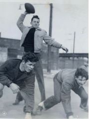 Three men playing backyard football