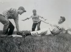 Three men playing baseball