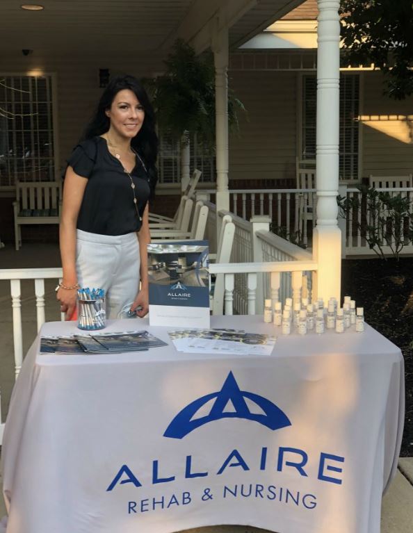 Female Allaire rehab representative at tailgate and a movie night