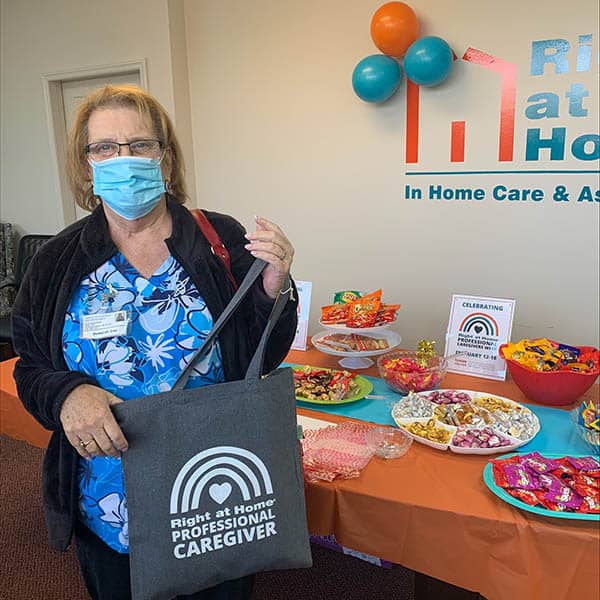 Caregiver with tote and lots of candy.