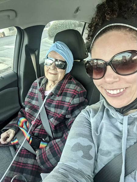 caregiver and senior in car