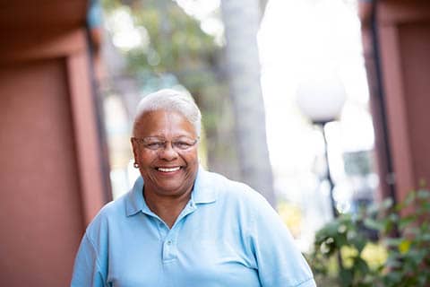 smiling elderly female volunteer