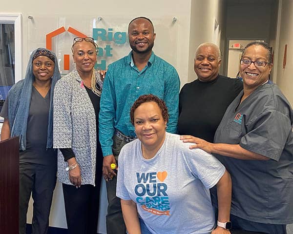 A group of caregivers and staff members at the Summer Bash.