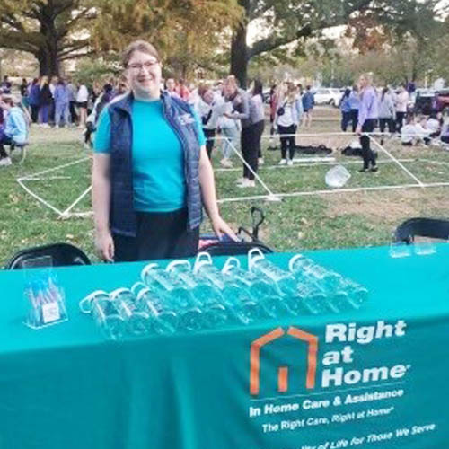 Right at Home female staffer hosting our exhibit table.