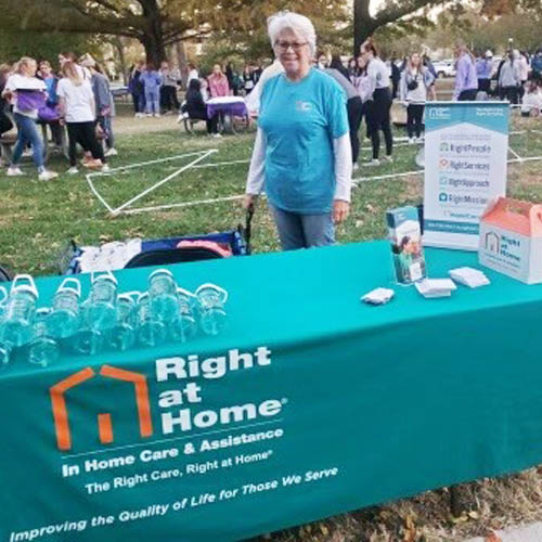 Female Right at Home staffer staffing our booth.