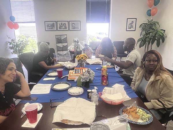 Some Right at Home Houston caregivers eating lunch together during a caregiver appreciation event