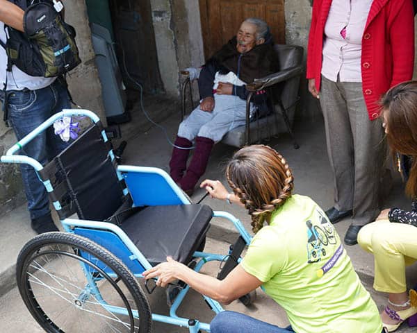 Receiving her wheelchair.