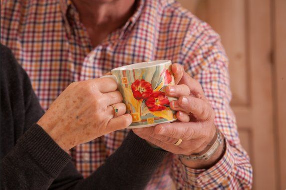 Couple holding mug