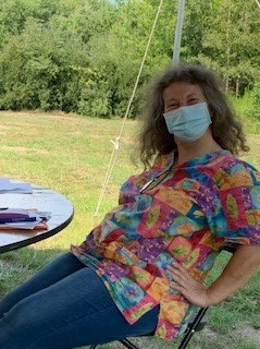 A Right at Home Southern New Hampshire Caregivers undergoing annual training outside under a tent