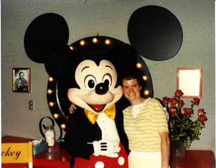 Right at Home of Southern New Hampshire Hero of the Pandemic spotlight, Lisa Weisberg, posing with mickey mouse.