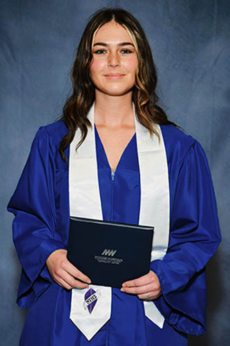 Standard Cap-and-Gown Graduation Photo of Female Caregiver from graduating NCLEX and becoming a board certified LPN