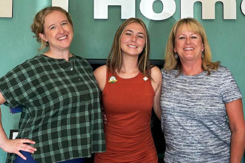 Two Female Leaders of Right at Home Edmond, Norman, and Stillwater Posing With Caregiver Graduate Kristan