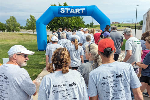 A group of people beginning to walk through the Start Gate at the Oklahoma City Parkinson's Walk Fundraiser