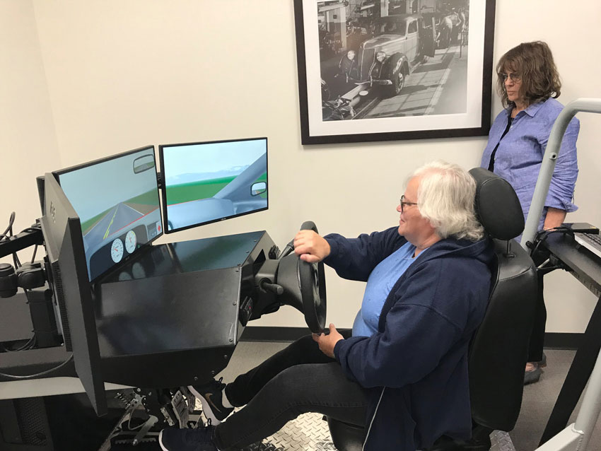 Senior Woman using Driving Simulator