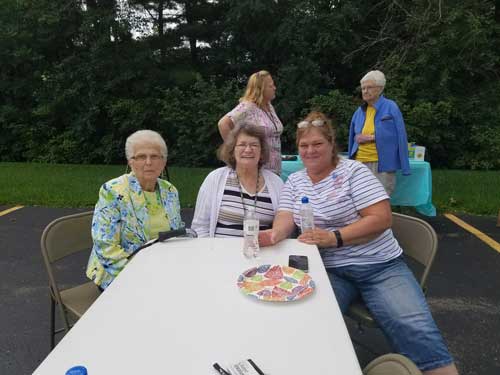 Caregiver and Clients at Table