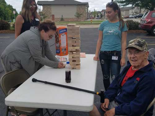 Caregiver and Clients Playing Jenga
