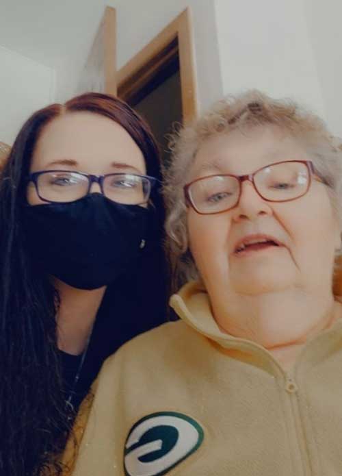 Caregiver with mask and client