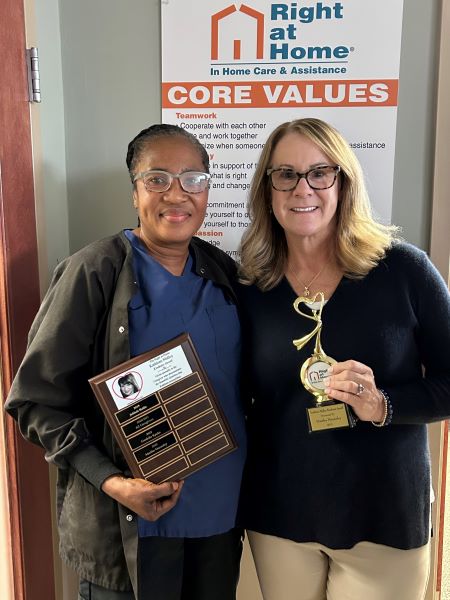 Martha holding Kathleen Malloy Award plaque and Denise Bernstein