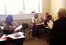 Nurse leading a training class for caregivers