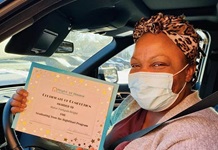 Caregiver showing off her RightStart training completion certificate