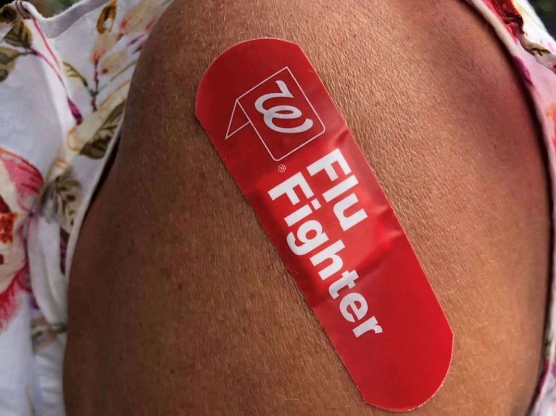 Caregiver donning her Flu Fighter bandage