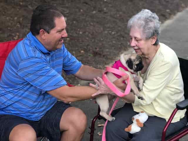 Doug and Carol with pugs