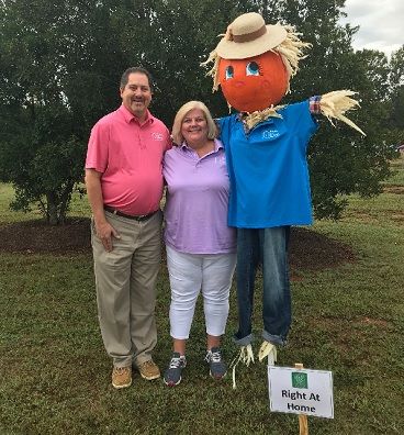 Right at Home Owners Doug and Lori Bochat with ScareCrow at Riverfest in Canton TN