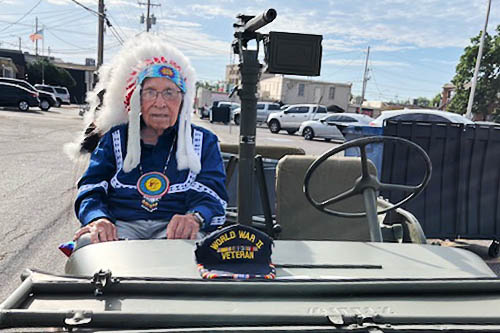Native American and WWII Veteran Centenarian Veteran Sitting in WWII Jeep as the Bethany Parade Grand Marshal
