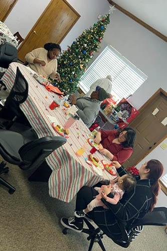 Right at Home's caregivers and staff enjoying our office Christmas celebrations