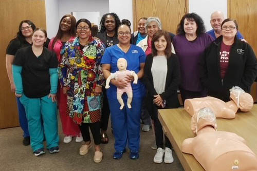 Group of Caregivers Posing for a CPR Training Graduation Photo