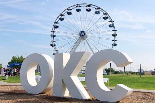 Parkinson Walk 2023 OKC Sculpture with Farris Wheel Background