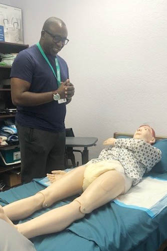 Male Caregiver Training with a Mannequin for Bed Transitions