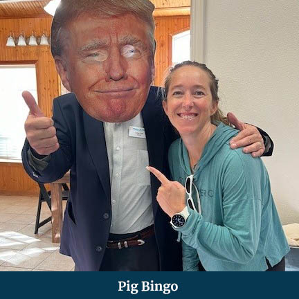 Woman posing next to a cut-out of President Trump