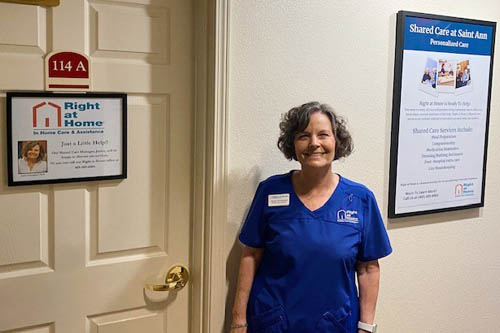 Saint Ann Retirement Center with Door Sign and a Wall Poster and a Female Caregiver