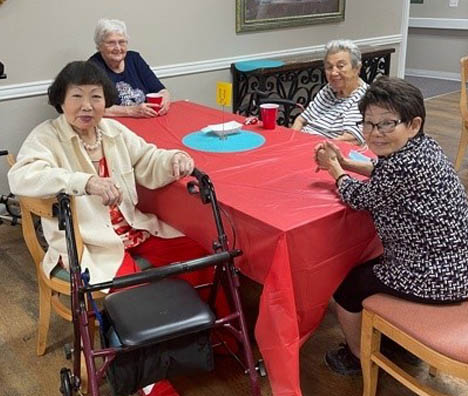 SW Mansions Cook Out-Senior Residents at the Table