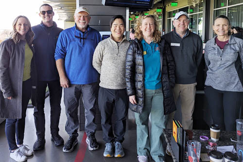 Row of Standing Men and Women Posing for the Camera at the Oklahoma Parkinson's Top Golf Event